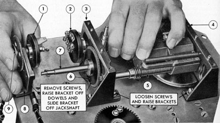 Figure 5-55. Removing follow-up contact assembly and top bracket.