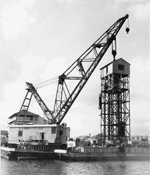 Crane barge dismantling the pier.