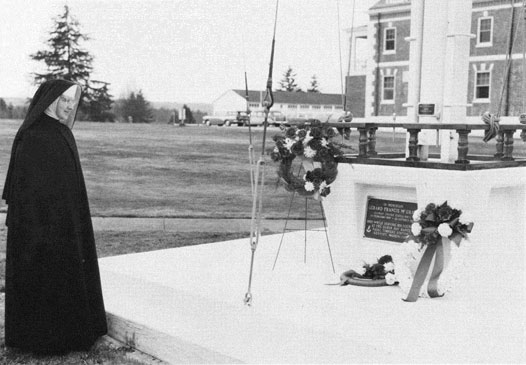 Photo of a nun viewing the memorial.