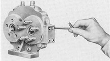 Figure 2-23. Removing replenishing valve block cover.