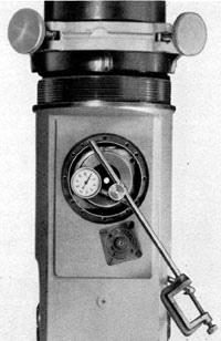 Figure 4-58. Dial indicator determination of true
vertical position on the left side face of the eyepiece
alignment jig.