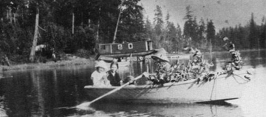 Photo of family out rowing a boat.