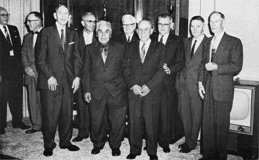 Twelve of the old-timers pose for a photo.