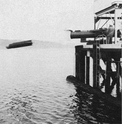 A torpedo is launched off the pier