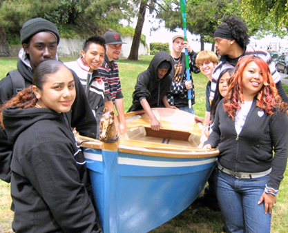 Students carrying their boat.